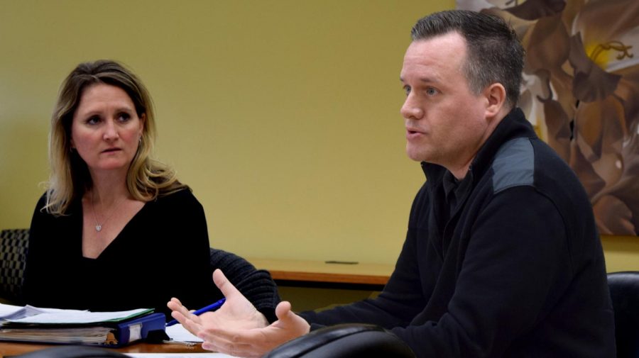 Stacey Ruholl, a kinesiology and sports studies professor and the Council on Academic Affairs chair, sits with Art Department Chair Chris Kahler Thursday afternoon in Booth Library. Kahler presented two revised majors and a revised minor to the CAA.