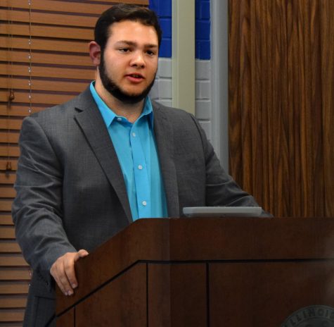 Zac Cohen, a sophomore accounting major and the student vice president for student affairs, peaks at the Student Senate Forum, Thursday evening in the Martin Luther King Jr. University Union. He is running uncontested for the position of executive vice president. 