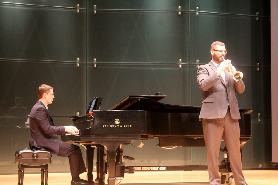 Benjamin Hay and Jonathan Bowman perform “Centennial Horizon” on the piano and trumpet Monday evening.