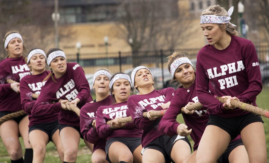 Members of Alpha Phi compete in “Tugs” Monday afternoon at the Campus Pond. They won the round against Alpha Gamma Delta.