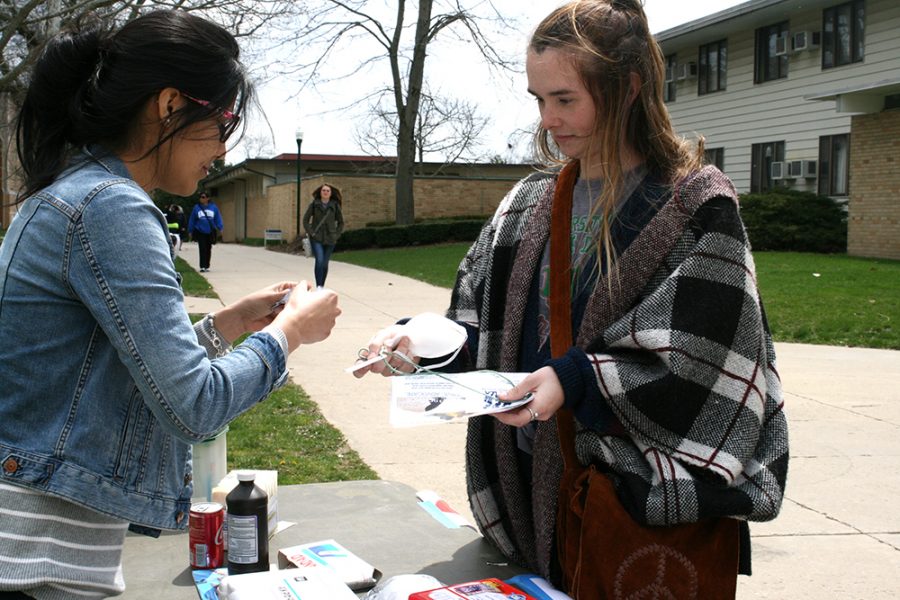Olivia Meents, a junior political science major is inspected at the “health” station of the refugee camp.