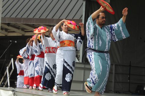 The Bon Odori group performs a Japanese dance for crowd members on Saturday during Celebration.