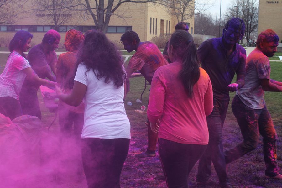 Students gather colors to throw at each other during Holi: Festival of Colors on Saturday in the South Quad.