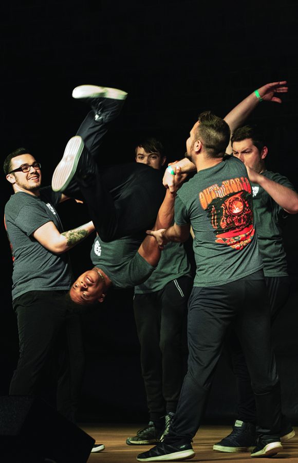 Members of Delta Chi compete in Airband in McAfee Gym Saturday night.