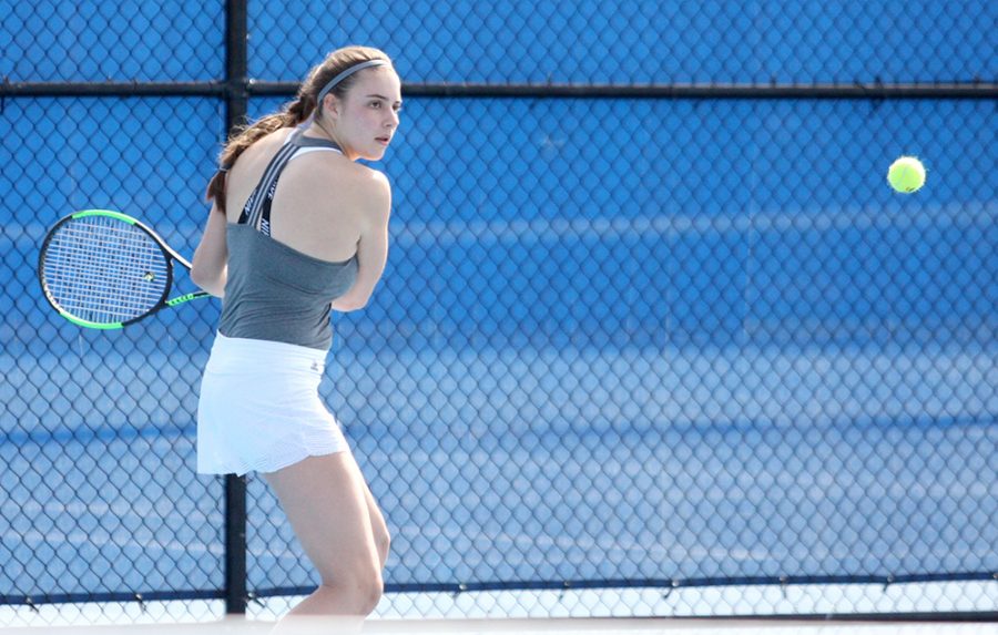 Sophomore Stella Cliffe returns the ball on her backhand in her doubles match Friday at the Darling Courts. Cliffe was named OVC Women’s Tennis Player of the Week on Wednesday.