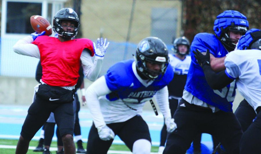 Easterns new quarterback Johnathan Brantley throws a pass in spring football on April 4th at OBrien Field. Brantley is a transfer from Tulane and one of four quarterbacks in camp for Eastern.