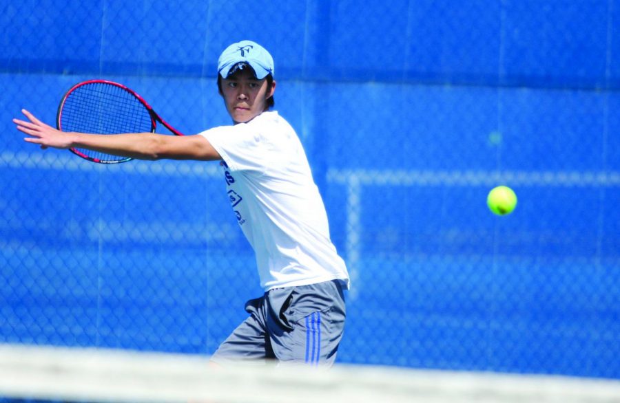 Freshman Kaisei Kuroki looks to hit a forehand over the net in his singles match March 30 at the Darling Courts against Belmont. Eastern starts the OVC Tournament Friday.