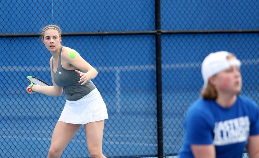 Sophomore Stella Cliffe returns the ball in her doubles match with partner Grace Summers against Belmont March 30 at the Darling Courts. The Panthers open the OVC Tournament this weekend.