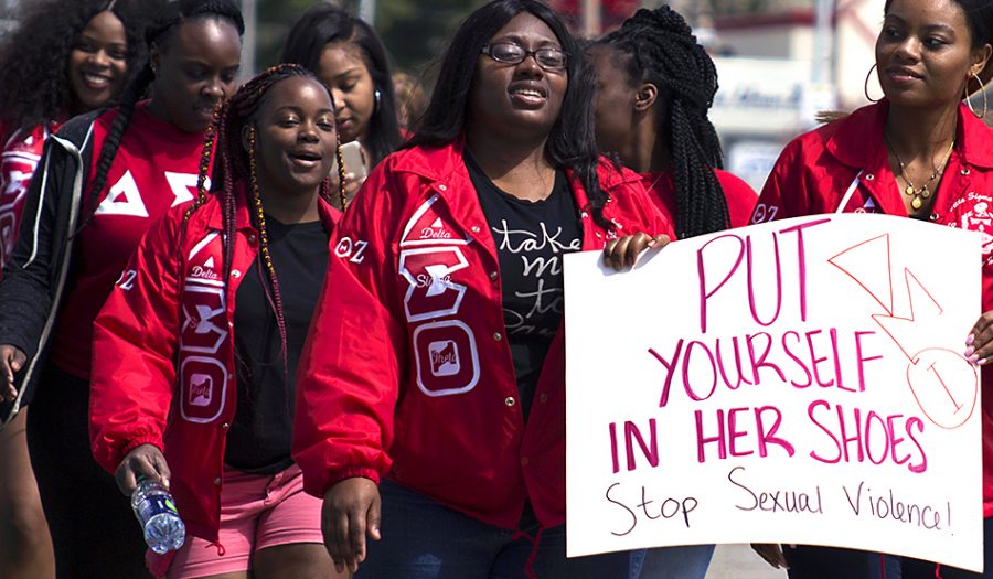 Members of Delta Sigma Theta participate in “Walk a Mile in Her Shoes,” Sunday along Lincoln Avenue. The sorority won the “Dream Team” award for having the largest number of people in their group.