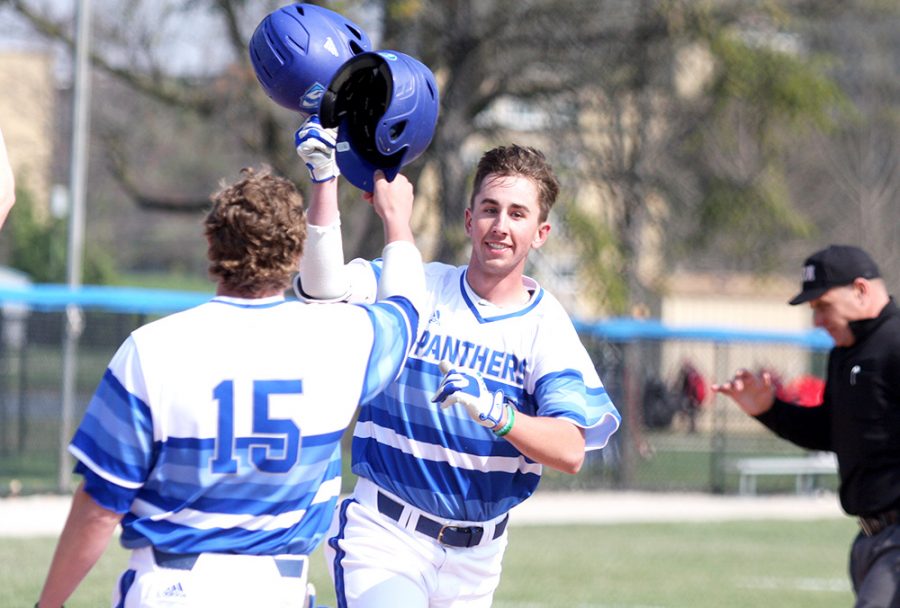 Junior Jimmy Huber celebrates his second home run of the first inning with redshirt junior Tyler Tesmond, who scored on Huber’s two-run home run. The Panthers beat Illinois State 17-13 Wednesday at Coaches Stadium.
