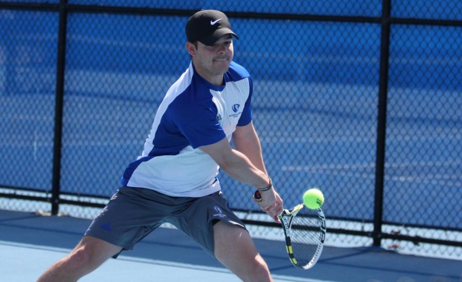 Eastern senior Grant Reiman returns a ball in the Panthers meet last Friday at the Darling Courts. Reiman and his partner lost in the No. 3 doubles position.