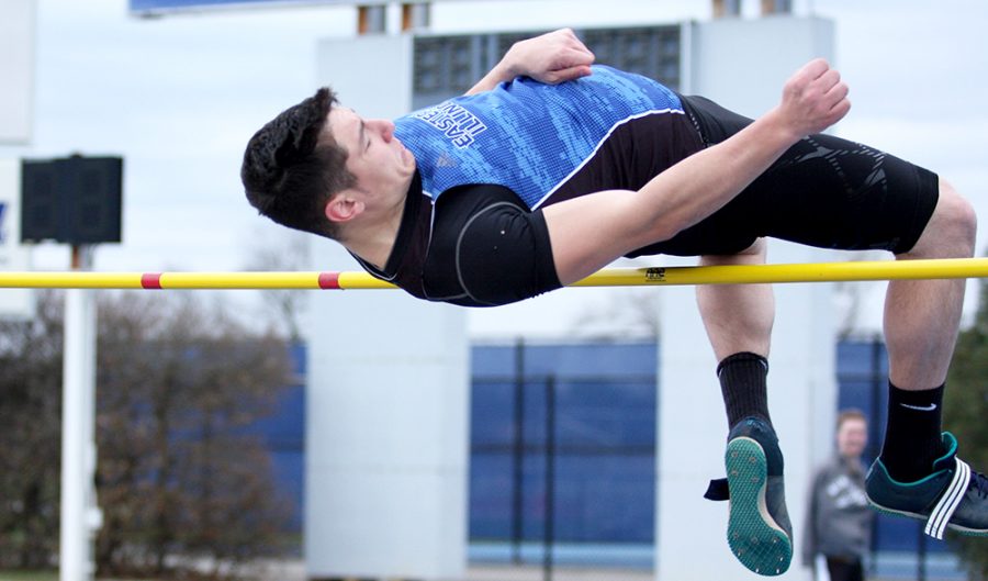 Junior Ashton Wilson jumps over the bar in the men’s high jump at the EIU Big Blue Meet March 31 at O’Brien Field. WIlson finished tied for second after jumping 6-feet-.75 inches in the men’s high jump at the Illinois Twilight meet over the weekend.