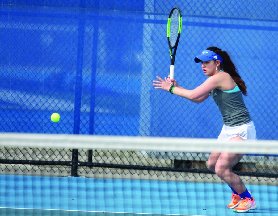 Eastern sophomore Emily Pugachevsky returns a ball in Eastern meet at the Darling Courts on March 30. The Panthers won the meet 5-2 against Belmont.