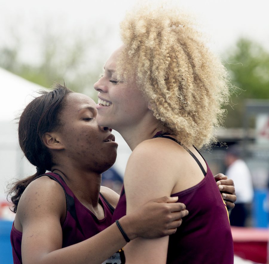 Brittany Rainey, and Kiara Pauli, both juniors at Dunlap High School, embrace each other after running in the 2A 200-meter dash Friday morning at the IHSA Girl’s Track & Field Semifinals at O’Brien Stadium. Pauli received first place in the second heat and will go on to compete Saturday in the finals.
