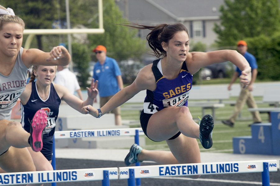 Karyn Best, a senior at Wheaton Academy, Paige Olson, a sophomore at Rochester High School, and Emelia Ness, a sophomore at Monticello High School, compete in the IHSA Girl’s semifinal Track & Field 2A 100-meter high hurdles at O’Brien Stadium Friday morning. Ness qualified for the finals being held Saturday.