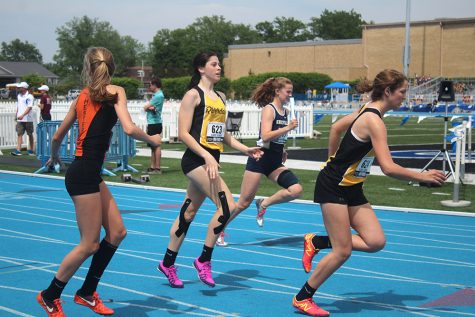 Students race to the finish line at the Illinois High School Association Girl’s Track and Field meet, Thursday afternoon at O’Brien Field.