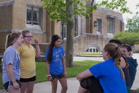 Graduate students majoring in communication and disorders sciences, talk with each other before one of their classes, Wednesday afternoon outside of Booth Library.