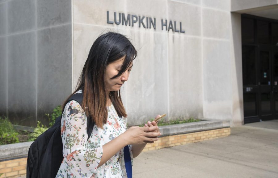 Jia Yuan, a visiting scholar from China is looking for her new office, Thursday afternoon outside of Lumpkin Hall. I just arrived a week ago, there are too many things to set up. Its pretty easy to get lost on campus.