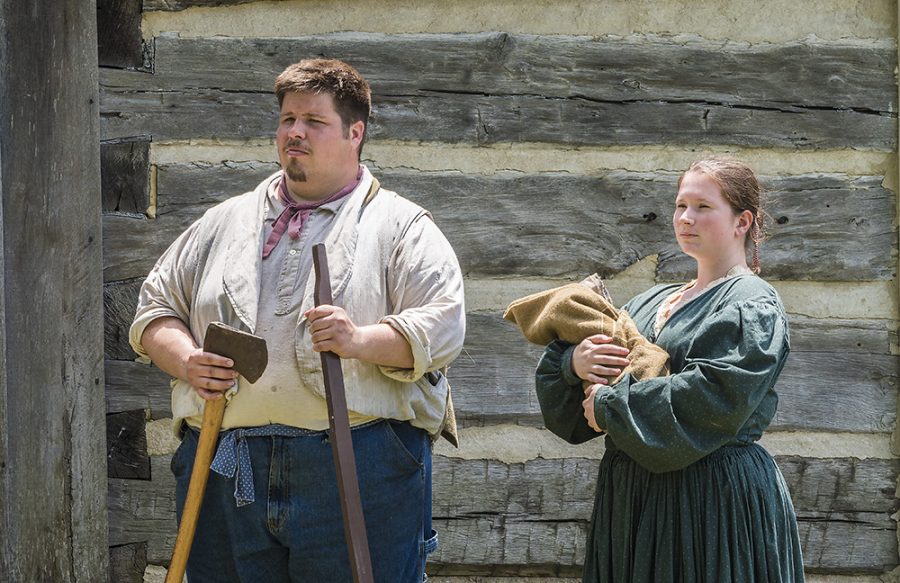 Jonathan Williams, a graduate student majoring in history, and Kate Gosnell, a senior history major, does a tableau performance of peoples life during the Civil War era, Saturday afternoon at Lincoln Log Cabin.