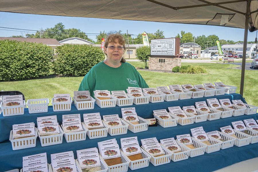 Deanna Shockey, a Mattoon resident, shows her spices product at 18th Street Farmers Market Vendorfest Saturday morning. The Bacon, Lettuce and Tomato spice is our most popular product. It tastes like a bacon, lettuce and tomato sandwich. We already sold out this type this morning.” Shockey said.