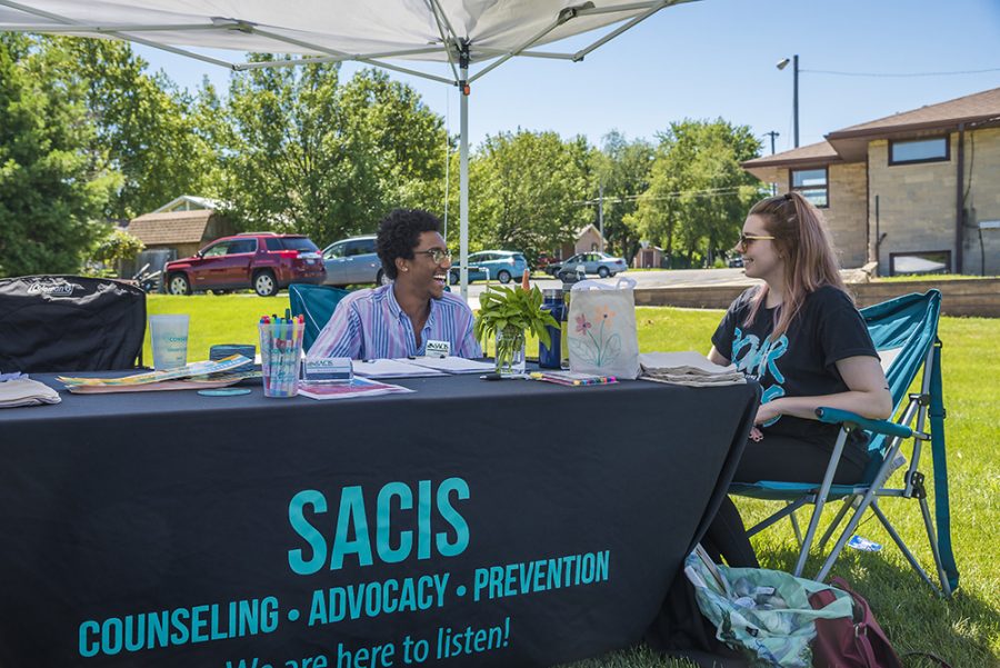 William Harrison, from Belleville and Beth Cundy, from Dearborn, MI. at the Sexual Assault Counseling and Information Service (SACIS) tent at the 18th Street Farmers Market Vendorfest Saturday morning. Our job in counseling for those people and child who has been hurt, said Harrison. Both of them were there as a part of their internships at SACIS.