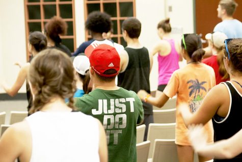 The Smith Walbridge Drum Major Clinic's camp members learning and practicing difficult music cadences during their camp Tuesday afternoon in the Buzzard Hall Auditorium. They were going through the motions along to music as their instructor coached and encouraged them.