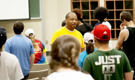 Kelvin Jones, Director of Bands at Louisiana State University, leads the Smith Walbridge Drum Major Clinic Tuesday Afternoon in the Buzzard Hall Auditorium. It is a marching band and drum major leadership focused camp. “It’s the first in America. It has been at Eastern since 1988,” James O’Neill, a staff member at the camp said, “There are at least 300 campers just in the camp this week.”