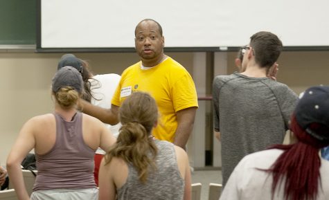 Kelvin Jones, Director of Bands at Louisiana State University, leads the drum major campers participating in the Smith Walbridge Drum Major Clinic Tuesday afternoon in the Buzzard Hall Auditorium. Jones kept the campers active and engaged and had them look for unusual music patterns in the music they were reading. This was the 70th anniversary of the camp.