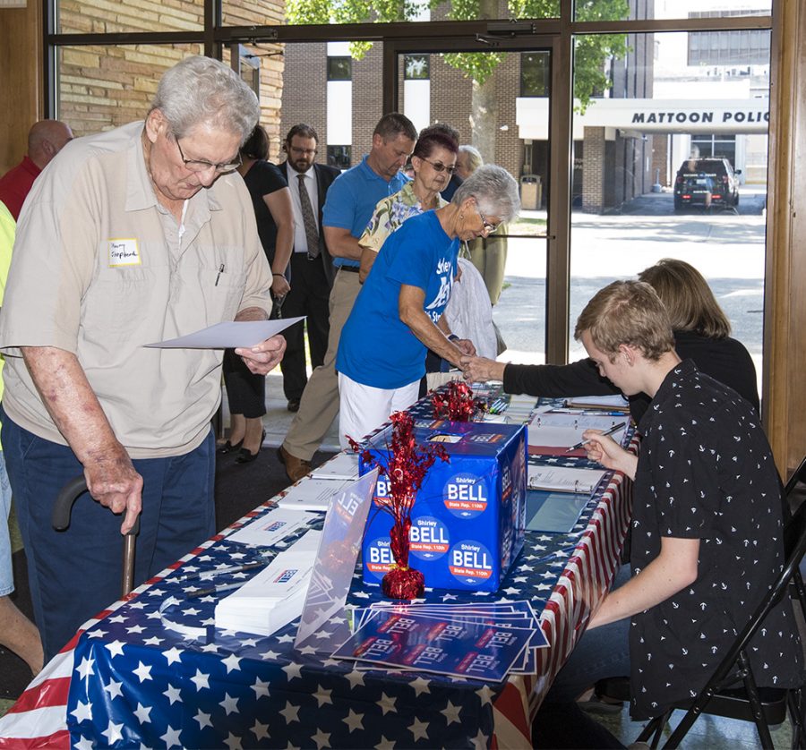 Locals sign in and make donations to support Shirley Bell’s campaign for state representative of the 110th District Tuesday afternoon at Burgess-Osborne Auditorium.