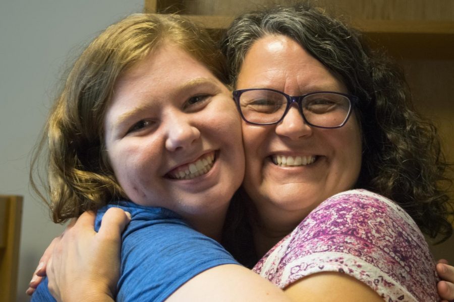 Rachel Mette, an incoming freshman graphic design major from Effingham, embraces her mother Lisa Mette in her new dorm room in Andrews Hall Thursday during Easterns move-in day. Many freshmen and students, like Rachel Mette, started Prowl weekend with a teary goodbye from their family.