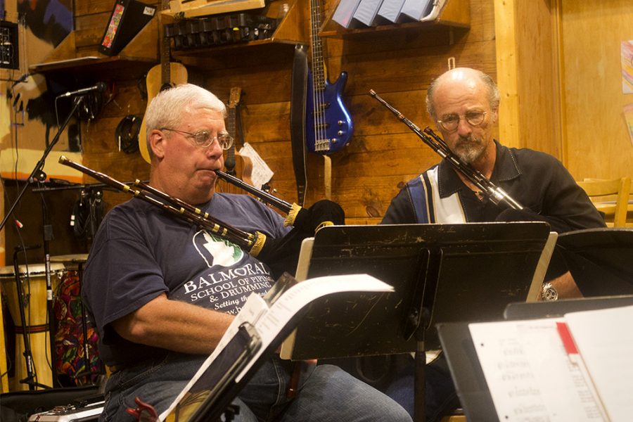 Paul Hinson, and Gary Rollings, members of the “Irish Music Circle” perform for the crowd Tuesday evening at Jackson Ave. Coffee.