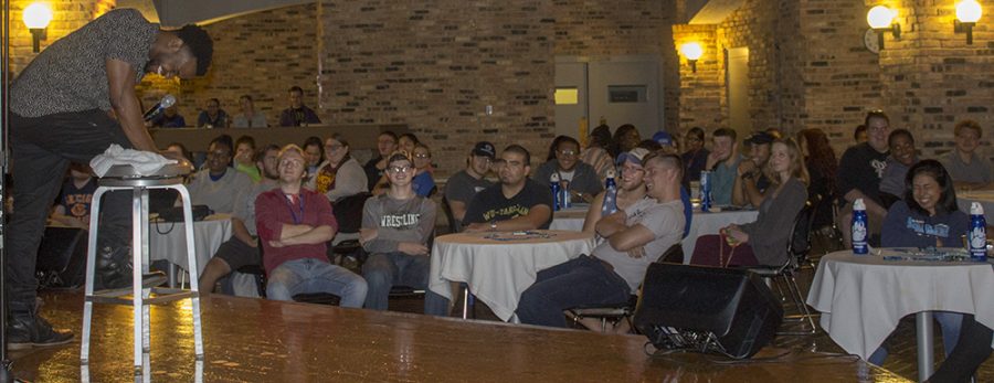 Comedian Barry Brewer laughs with audience Friday night during his comedy show in the 7th Street Underground of the Martin Luther King Jr. University Union.