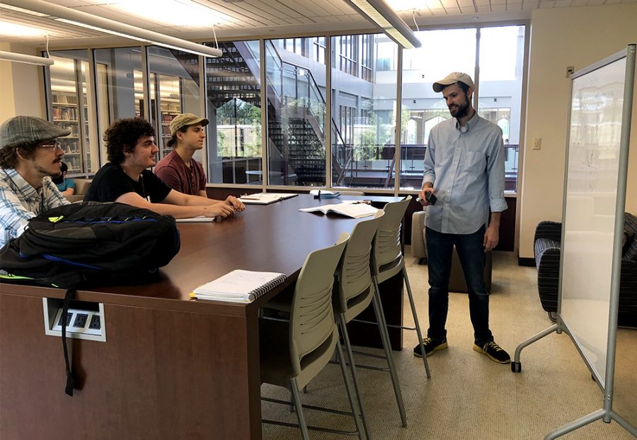 Students listen to a presentation during the Booth Library tour Monday in Booth Library.