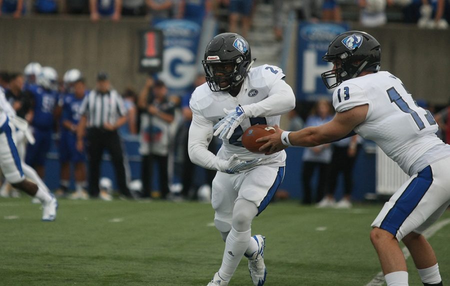 File Photo | The Daily Eastern News
Eastern running back Isaiah Johnson takes handoff form Mitch Kimble in a Panthers’ 22-20 win over Indiana State last season. Johnson was selected as a preseason all-conference player.