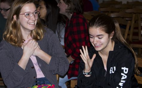 Emma Dambek, a senior history major, and Mariah Slaughter, a junior sociology major, try to figure out the answer to a question at the Rocfest trivia night Monday afternoon in the Pemberton Great Room. They were on the Lincoln Hall team.