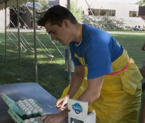 Ryan Moore, a freshman history major who was a part of Thomas Hall, puts an egg on a spoon and prepares to run up and down the outside library stairs during the ROCFest obstacle course.