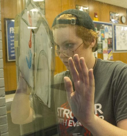 Lyric Ailshire, a freshman pre-medicine major, paints a mailbox in Thomas Hall Sunday night for the RocFest window painting competition. The theme this year for ROCFest is “Panthers go to Hollywood,” and residents from Thomas Hall are painting scenes from “Up.” The windows will be judged at 8 a.m. Thursday.