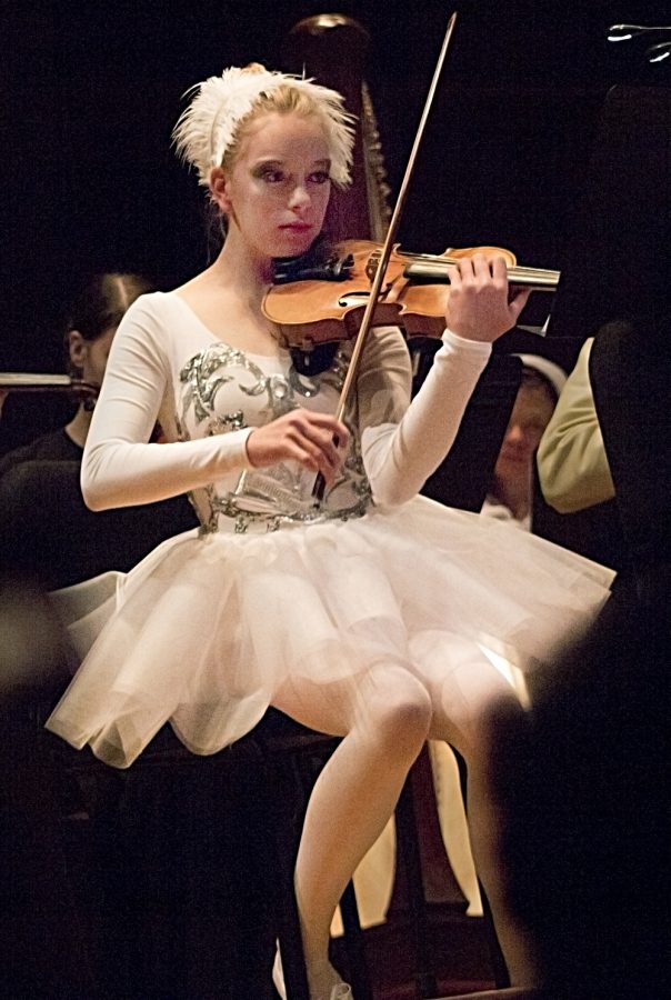 Sadie Armstrong plays the violin in her handmade Swan Lake costume. “I was like ‘What am I going to be?’” Armstrong said. “Then we were playing (Swan Lake) so I was like ‘Oh I’ll just do that.”