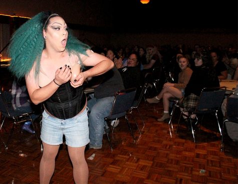 Fantasia Blackheart, a drag performer, adjusts herself during her performance at the Grand Ballroom. She performed two songs during the event.