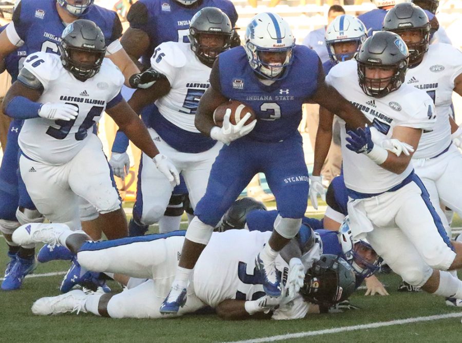 Indiana State running back ja’Quan Keys runs through a tackle attempt by Levi Watson (99) as linebacker Joe Caputo (45) runs in to bring him down. The defense for Eastern has been a focal point all season, and this week against Murray State the unit hopes to play well for all four quarters.