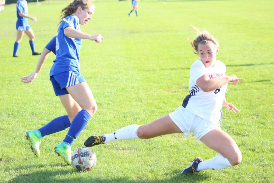 Eastern junior Lexi Ketterhagen dribbles around a Belmont defender in the match on Sept. 28. The Panthers lost to the Bruins by a score of 3-1.