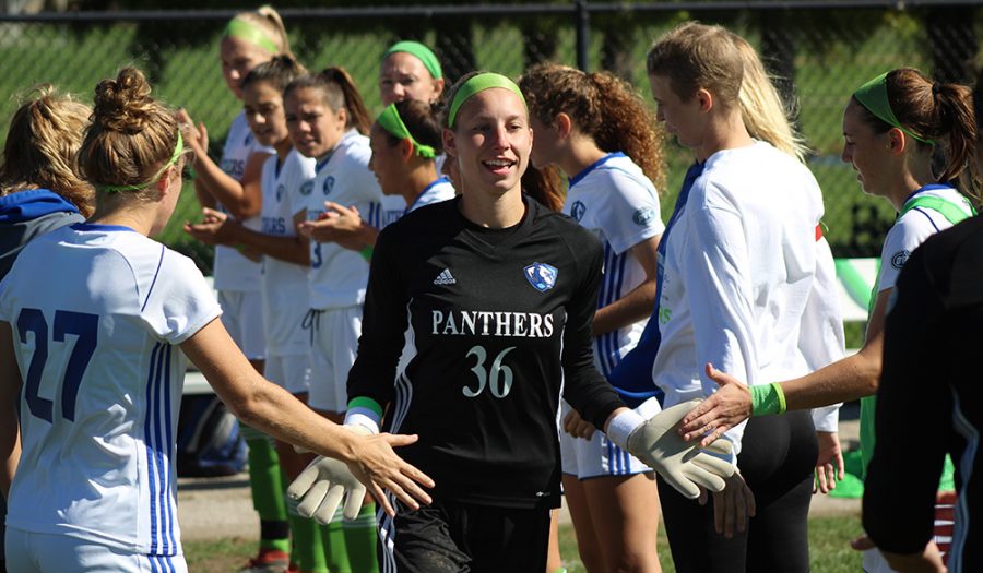 Eastern junior goalkeeper Sara Teteak high fives her teammates prior to a match against Southeast Missouri on Oct. 11. Eastern is the third seed in the Ohio Valley Conference tournament.