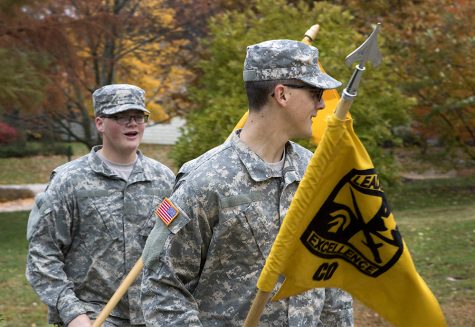 Army ROTC Cadets Michael Barnes, a finance major, and Matthew Riley a psychology major, walk with ROTC flags Thursday afternoon outside of the Martin Luther King Jr. University Union.