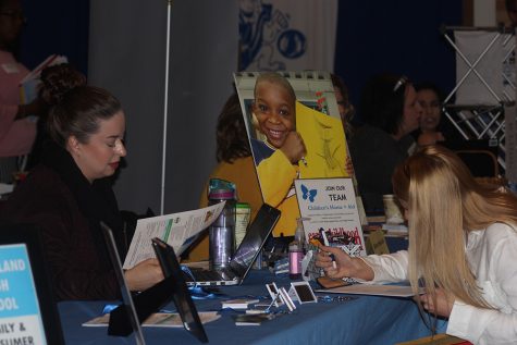 Kari Daniel and Taylor Hathcoat converse at the Fall Education Job Fair held Wednesday in the Grand Ballroom of the Martin Luther King Jr. University Union.