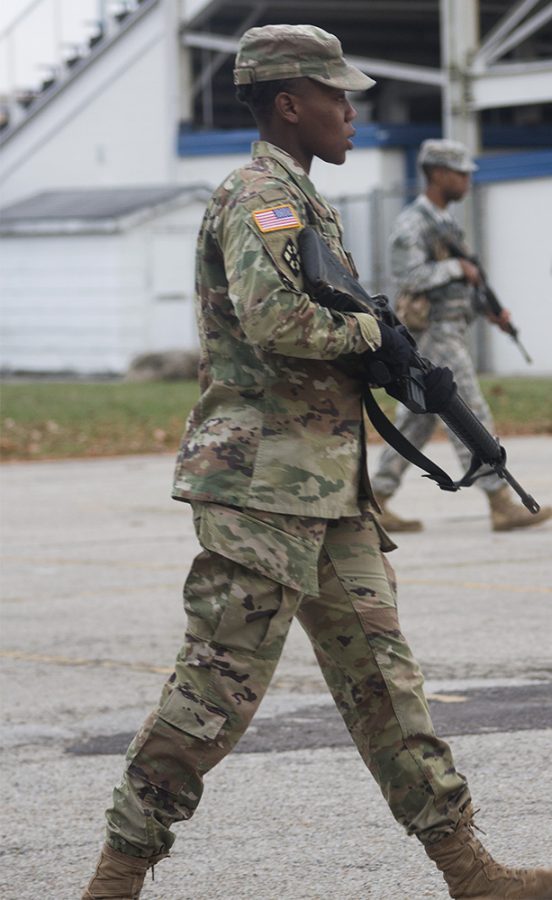 Cadet Chermaine King, a construction management major, walks during the Army ROTC training exercise Thursday afternoon outside of O’Brien Stadium.