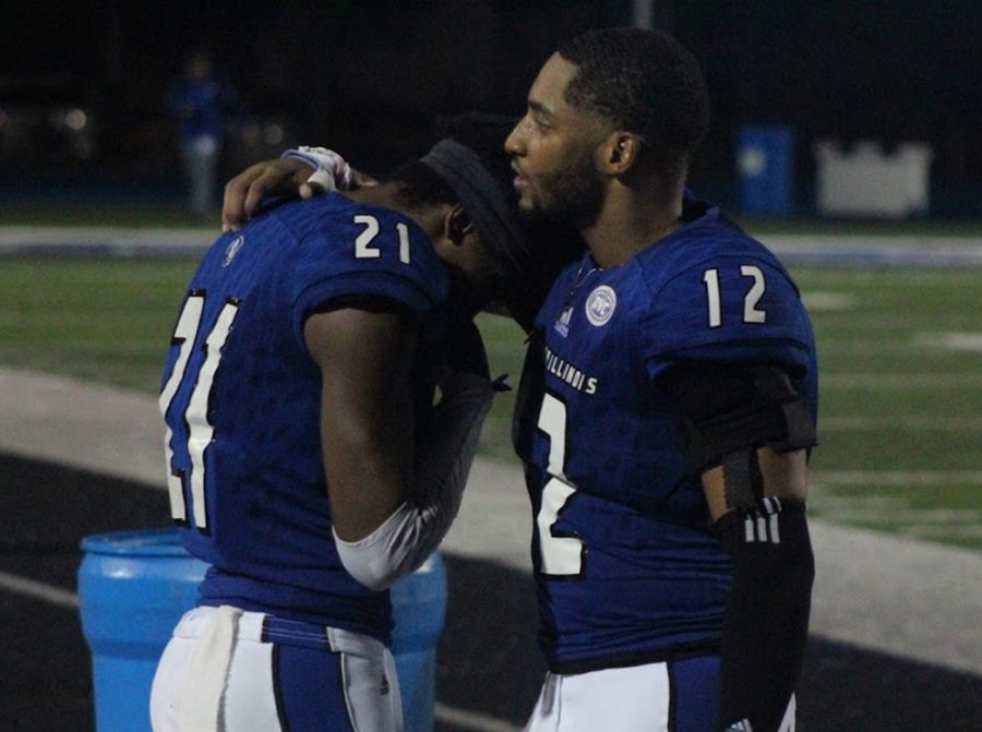 Eastern cornerback DySaun Smith (12) consoles his teammate Mark Williams (21) following a 48-41 loss to Murray State on Oct. 6. The loss was one of the lowpoints in Eastern’s 3-8 season.