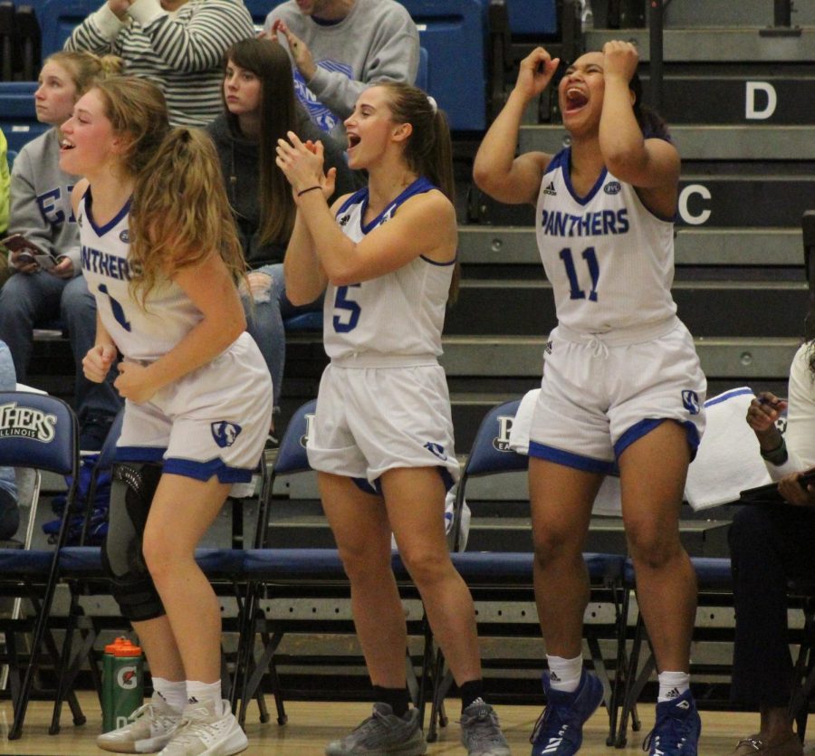 Eastern basketball players (from left) Kira Arthofer, Grace Lennox and Karle Pace celebrate the Panthers breaking the 100-point mark late in the game on Nov. 6 against Oakland City. It was the first time since 2009 the Panthers reached 100 points.