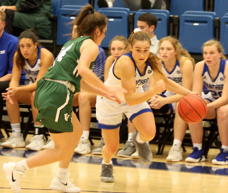 Eastern redshirt-senior Grace Lennox drives against a defender in the Panthers’ exhibition win over Illinois-Wesleyan on Nov. 1. The Panthers have already won three games this season in five games, matching their win total from all of last season.