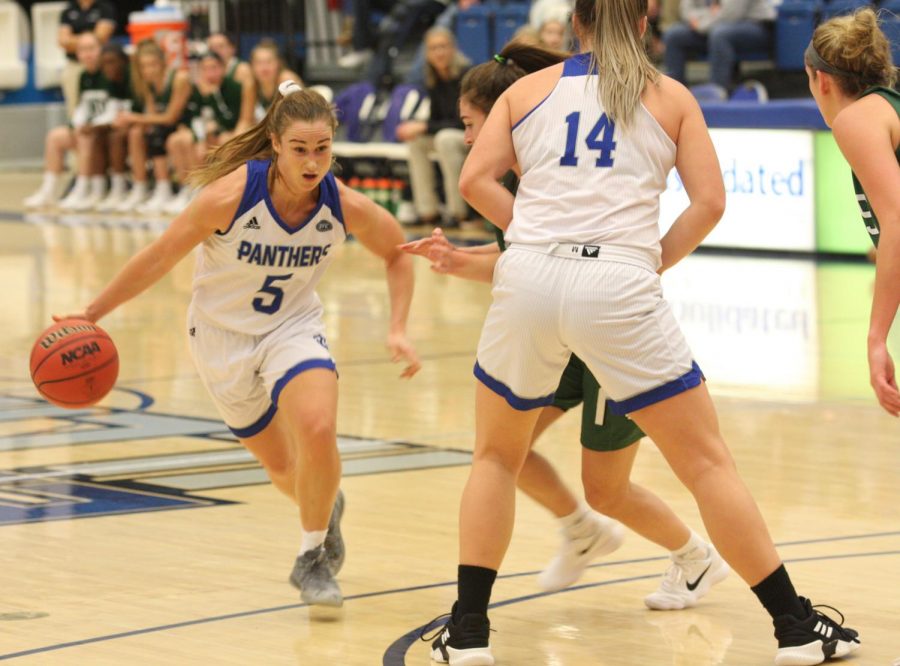 Eastern+redshirt-senior+guard+Grace+Lennox+dribbles+around+a+defender+in+the+Panthers+86-82+exhibition+win+over+Illinois-Wesleyan+Thursday+night+in+Lantz+Arena.+Lennox+had+22+points%2C+six+rebounds+and+11+assists+in+the+game+and+did+not+commit+a+turnover.