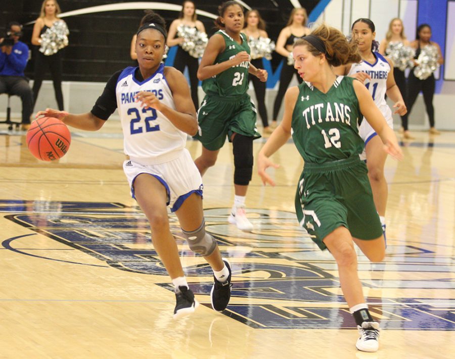 Eastern fifth-year senior Damonique Miller takes the ball upcourt in the Panthers’ exhibition win over Illinois-Wesleyan on Nov. 1. Miller began the season as Eastern’s first forward off the bench, but has seen her time reduced.
